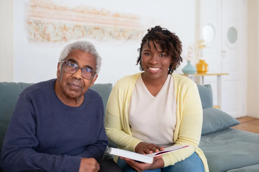 A caregiver reading with a senior